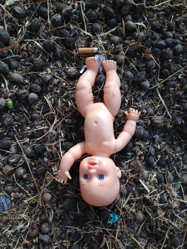 Buy art online, Ricardo Tomasz, toy, Wood Chips, Los Angeles, blue eyes, play time, cigarette, dirt, doll, abstract, abandonned, innocence, baby